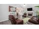 Spacious living area featuring a fireplace, TV, and open layout to the dining area at 169 Winding Valley Dr, Rockmart, GA 30153