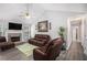 Comfortable living room with a stone fireplace, TV, and stylish decor at 169 Winding Valley Dr, Rockmart, GA 30153