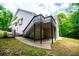 A home with backyard deck, stairs, and a covered patio, perfect for outdoor enjoyment at 9691 Squirrel Wood Run, Douglasville, GA 30135