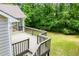 Elevated view of the home's wooden deck with an expanse of lush trees at 9691 Squirrel Wood Run, Douglasville, GA 30135