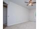 Spacious bedroom with ceiling fan and neutral carpeting at 9691 Squirrel Wood Run, Douglasville, GA 30135