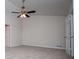 Large bedroom with neutral walls, carpet, and a ceiling fan for added comfort at 9691 Squirrel Wood Run, Douglasville, GA 30135