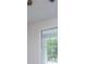 Bright bedroom with large window, letting in natural light and a view of the outdoors at 9691 Squirrel Wood Run, Douglasville, GA 30135