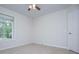 Bedroom features carpet, window and a door to another room at 9691 Squirrel Wood Run, Douglasville, GA 30135