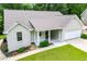 Beautiful single-story home boasting a painted brick front, covered entrance, attached garage, and green lawn at 9691 Squirrel Wood Run, Douglasville, GA 30135
