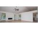 Bright and spacious living room featuring hardwood floors, a modern fireplace, and ample natural light at 9691 Squirrel Wood Run, Douglasville, GA 30135