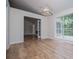 Living room features wood look floors, bright light, and an open floorplan at 9691 Squirrel Wood Run, Douglasville, GA 30135