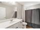 Well-lit bathroom with modern vanity, large mirror, and shower with stylish curtain at 1896 Grove Field Ln # 29, Marietta, GA 30064