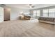 Spacious bedroom with two beds, carpet flooring and large windows allowing for abundant natural light at 1896 Grove Field Ln # 29, Marietta, GA 30064