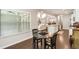 A sunny breakfast area featuring a table and chairs, and a view of the open-concept living space at 1896 Grove Field Ln # 29, Marietta, GA 30064