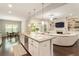 Open-concept kitchen with stainless appliances, a large island, and a seamless view of the adjacent living room at 1896 Grove Field Ln # 29, Marietta, GA 30064