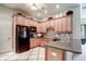 Cozy kitchen with wooden cabinets, modern appliances, and a stylish backsplash at 1896 Grove Field Ln # 29, Marietta, GA 30064