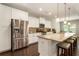 Modern kitchen featuring stainless steel appliances, granite countertops, and a spacious island with seating at 1896 Grove Field Ln # 29, Marietta, GA 30064