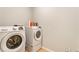 Modern laundry room with front-loading washer and dryer at 1896 Grove Field Ln # 29, Marietta, GA 30064