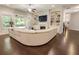 Bright living room with fireplace, built-ins, and hardwood floors, seamlessly connecting to the outdoors at 1896 Grove Field Ln # 29, Marietta, GA 30064