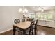 An open-concept living space including a dining table and access to an open kitchen at 1896 Grove Field Ln # 29, Marietta, GA 30064