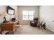 Cozy home office with a wooden desk, comfortable chair, and ample natural light from the window at 1896 Grove Field Ln # 29, Marietta, GA 30064