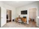 Versatile home office features a window, desk, tv, closet and entry into bedroom at 1896 Grove Field Ln # 29, Marietta, GA 30064