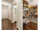 Spacious pantry with wire shelving for ample storage, adjacent to the bathroom and laundry area at 1896 Grove Field Ln # 29, Marietta, GA 30064