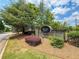 Charming neighborhood entrance sign for Grove Park, surrounded by mature landscaping and greenery at 1896 Grove Field Ln # 29, Marietta, GA 30064