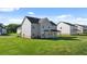 Expansive backyard with well-maintained lawn and neighboring homes at 281 Sandy Oak Dr, Loganville, GA 30052