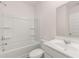 Bright bathroom with vanity, mirror, white fixtures, and tub/shower combination at 281 Sandy Oak Dr, Loganville, GA 30052