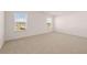 Bright bedroom with two windows and neutral carpeting, ready for personalization at 281 Sandy Oak Dr, Loganville, GA 30052
