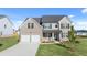 Beautiful two-story home featuring a two-car garage and stone accents on the facade at 281 Sandy Oak Dr, Loganville, GA 30052