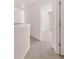 Upstairs hallway leading to a bright bedroom and bathroom at 281 Sandy Oak Dr, Loganville, GA 30052