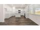 Bright kitchen features white cabinets, countertops, stainless appliances, and island at 281 Sandy Oak Dr, Loganville, GA 30052