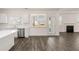 Kitchen with white cabinets, countertops, tile backsplash, and stainless appliances at 281 Sandy Oak Dr, Loganville, GA 30052