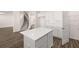 Kitchen with white countertops, cabinets, tile backsplash, and center island at 281 Sandy Oak Dr, Loganville, GA 30052