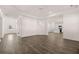 Open-concept living room and kitchen area with hardwood flooring, stainless appliances, and a center island at 281 Sandy Oak Dr, Loganville, GA 30052