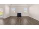 Bright living room with hardwood floors, a fireplace, and lots of natural light at 281 Sandy Oak Dr, Loganville, GA 30052