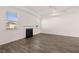 Spacious living room featuring a fireplace and two windows for natural light at 281 Sandy Oak Dr, Loganville, GA 30052