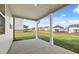 Covered patio offers views of the landscaped backyard and neighboring homes at 281 Sandy Oak Dr, Loganville, GA 30052