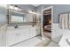 Bathroom with a double sink vanity, a large mirror, and neutral paint at 310 Arbor Creek Trl, Roswell, GA 30076