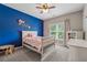 The bedroom has a cute theme, plenty of natural light, and ample storage space at 310 Arbor Creek Trl, Roswell, GA 30076
