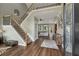 Grand foyer features a staircase, hardwood floors, and an open view to the living room at 310 Arbor Creek Trl, Roswell, GA 30076