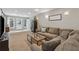 Comfortable living room featuring a large sectional sofa and sliding glass doors to the exterior at 310 Arbor Creek Trl, Roswell, GA 30076