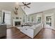 Spacious living room features a fireplace, vaulted ceiling, and a comfortable, light gray sectional sofa at 310 Arbor Creek Trl, Roswell, GA 30076