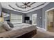 Bedroom featuring trey ceiling, ceiling fan, and large windows at 310 Arbor Creek Trl, Roswell, GA 30076