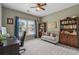 Office with ample natural light, built-in bookshelves, and ceiling fan at 310 Arbor Creek Trl, Roswell, GA 30076