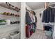 Spacious walk-in closet with organized shelving and hanging racks at 310 Arbor Creek Trl, Roswell, GA 30076