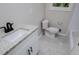 Bathroom featuring a white vanity with granite countertop and black fixtures and gray flooring at 6213 Cherry Ln, Douglasville, GA 30134