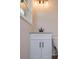 This bathroom features a white vanity with a granite countertop and a black faucet at 6213 Cherry Ln, Douglasville, GA 30134