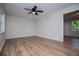 Bedroom featuring hardwood floors, neutral walls, and ceiling fan at 6213 Cherry Ln, Douglasville, GA 30134