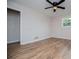 This bedroom features hardwood floors, a ceiling fan, and one window providing natural light at 6213 Cherry Ln, Douglasville, GA 30134