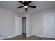 Bedroom features hardwood floors, a ceiling fan and a closet door, with neutral paint at 6213 Cherry Ln, Douglasville, GA 30134