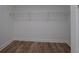 This closet features a white wire shelf and hardwood floors at 6213 Cherry Ln, Douglasville, GA 30134
